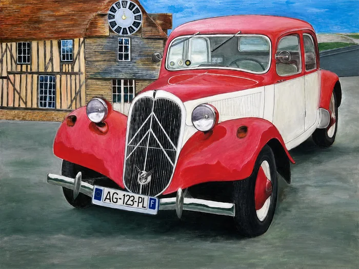 Une automobile ancienne devant une architecture normande